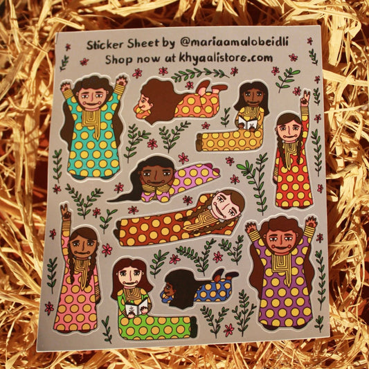 Emirati Girls Sticker Sheet featuring 10 stickers of Emirati girls in traditional Mukhwar dresses, illustrated in vibrant colors with a glitter finish. Perfect for planners, journals, phone cases, and more, these stickers celebrate cultural elegance and add a touch of tradition and creativity.
